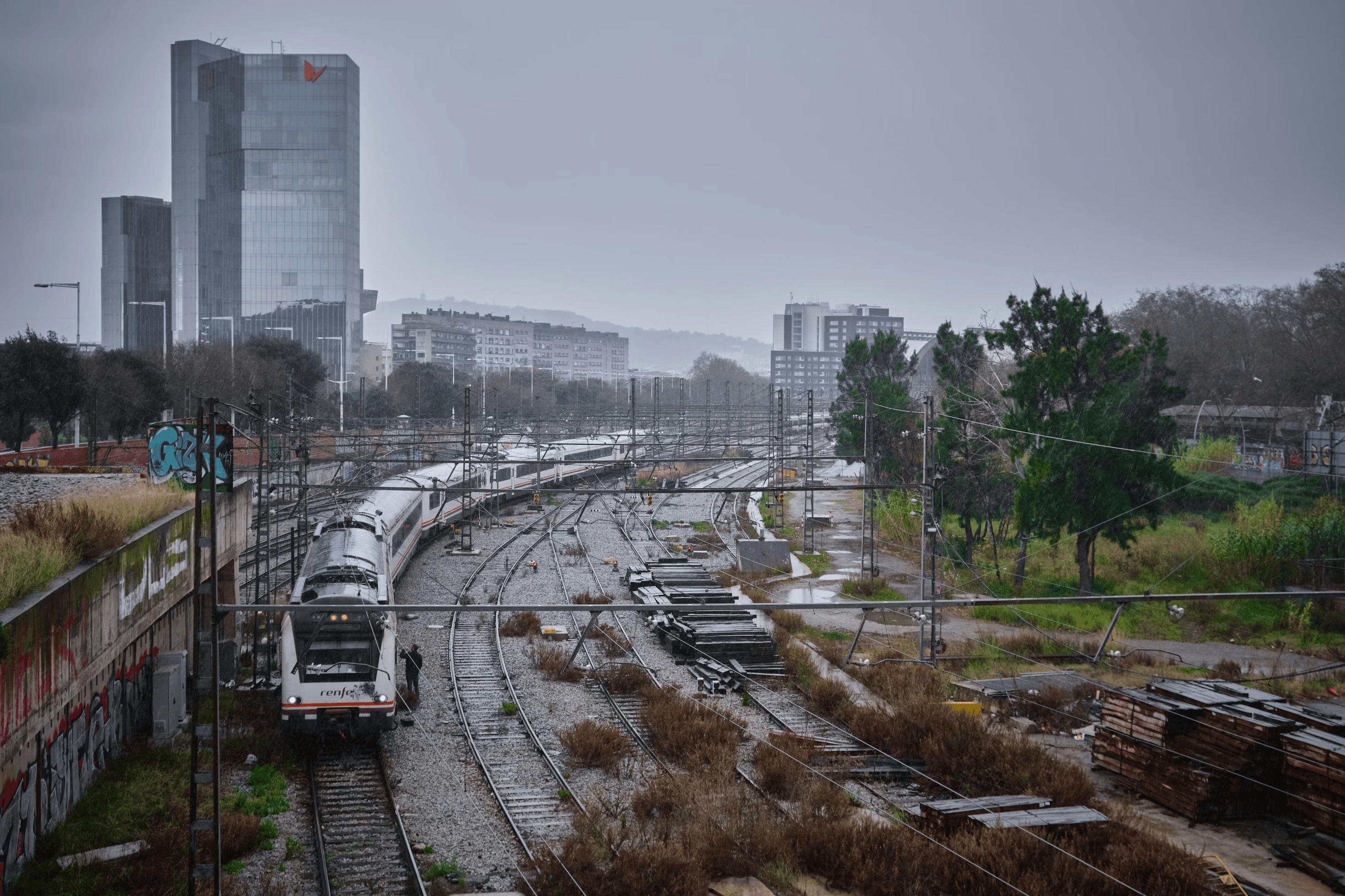 Barcelona rail station with city skyline